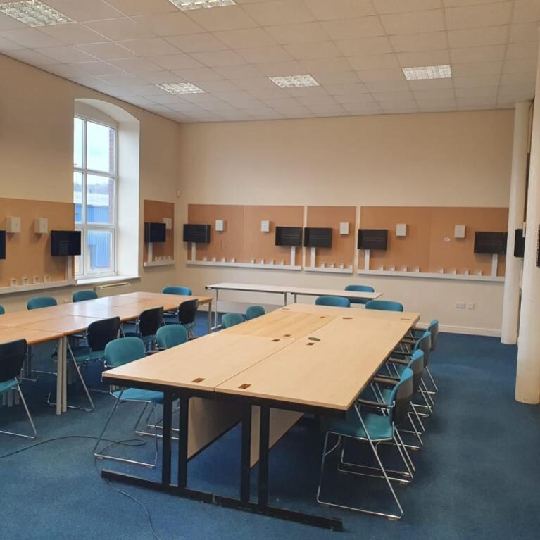 An empty telecommunications classroom in Oldham.